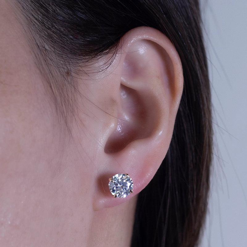Ohrringe, je 1,5 ct Hauptsteine, 18k Gold